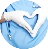 Medical professional forming a heart shape with hands in gloves, symbolizing care and compassion in healthcare.